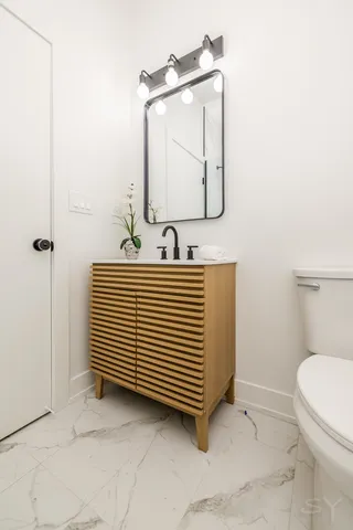 a bathroom with a sink a mirror and shower