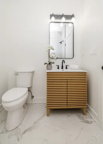 a bathroom with a sink and a toilet