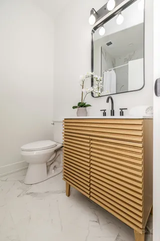 a view of a hallway with wooden shelves