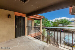 1620 North Wilmot Road, Unit D273 Tucson, AZ 85712 - Photo 1 of 15 a balcony with trees in front of it