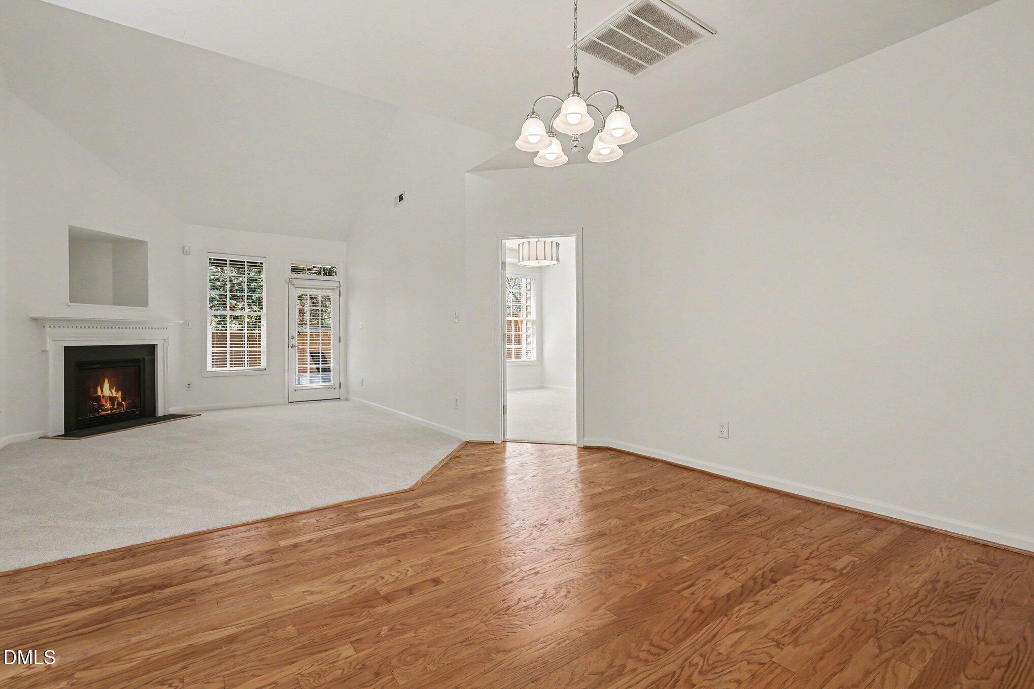 723 Swan Neck Lane Raleigh, NC 27615 - Photo 52 of 52 a view of an empty room with wooden floor and a window