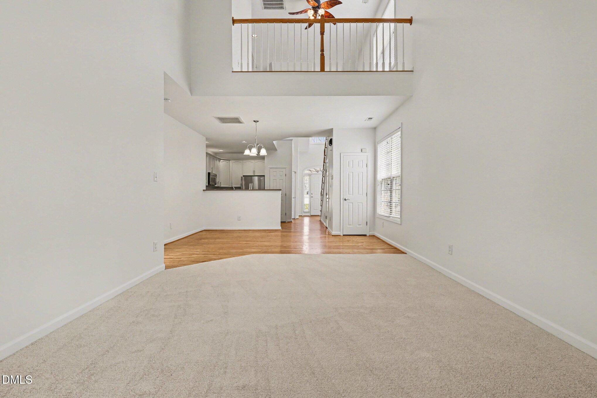 723 Swan Neck Lane Raleigh, NC 27615 - Photo 16 of 52 a view of a livingroom with wooden floor