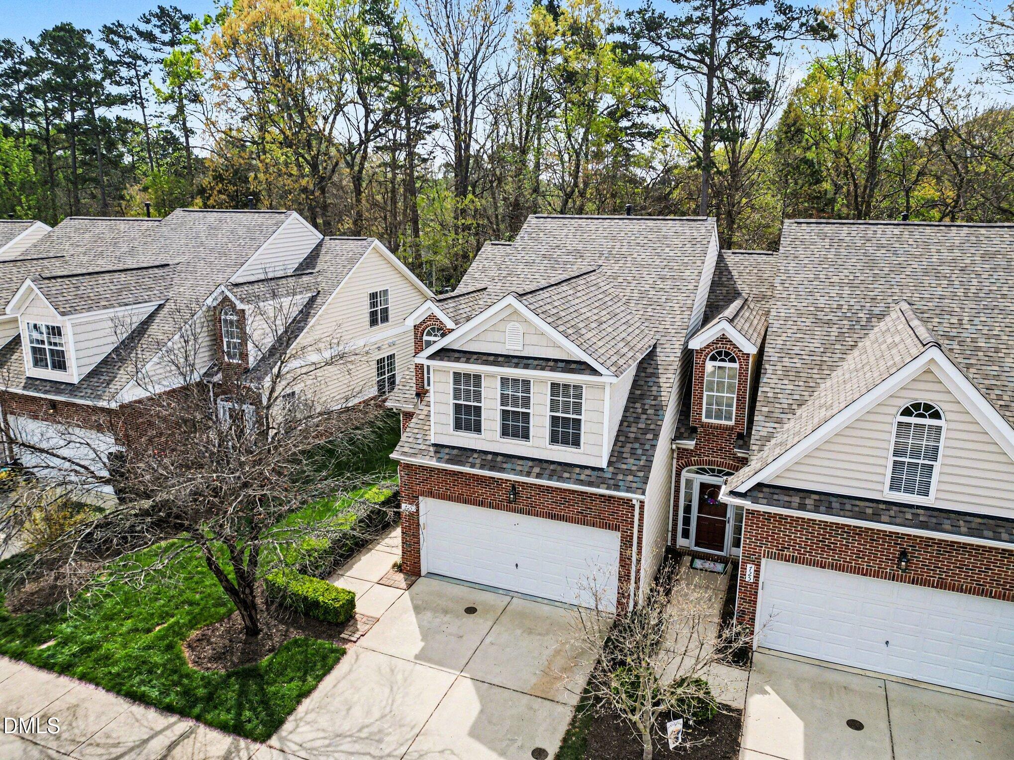 723 Swan Neck Lane Raleigh, NC 27615 - Photo 2 of 52 a aerial view of a house with a yard