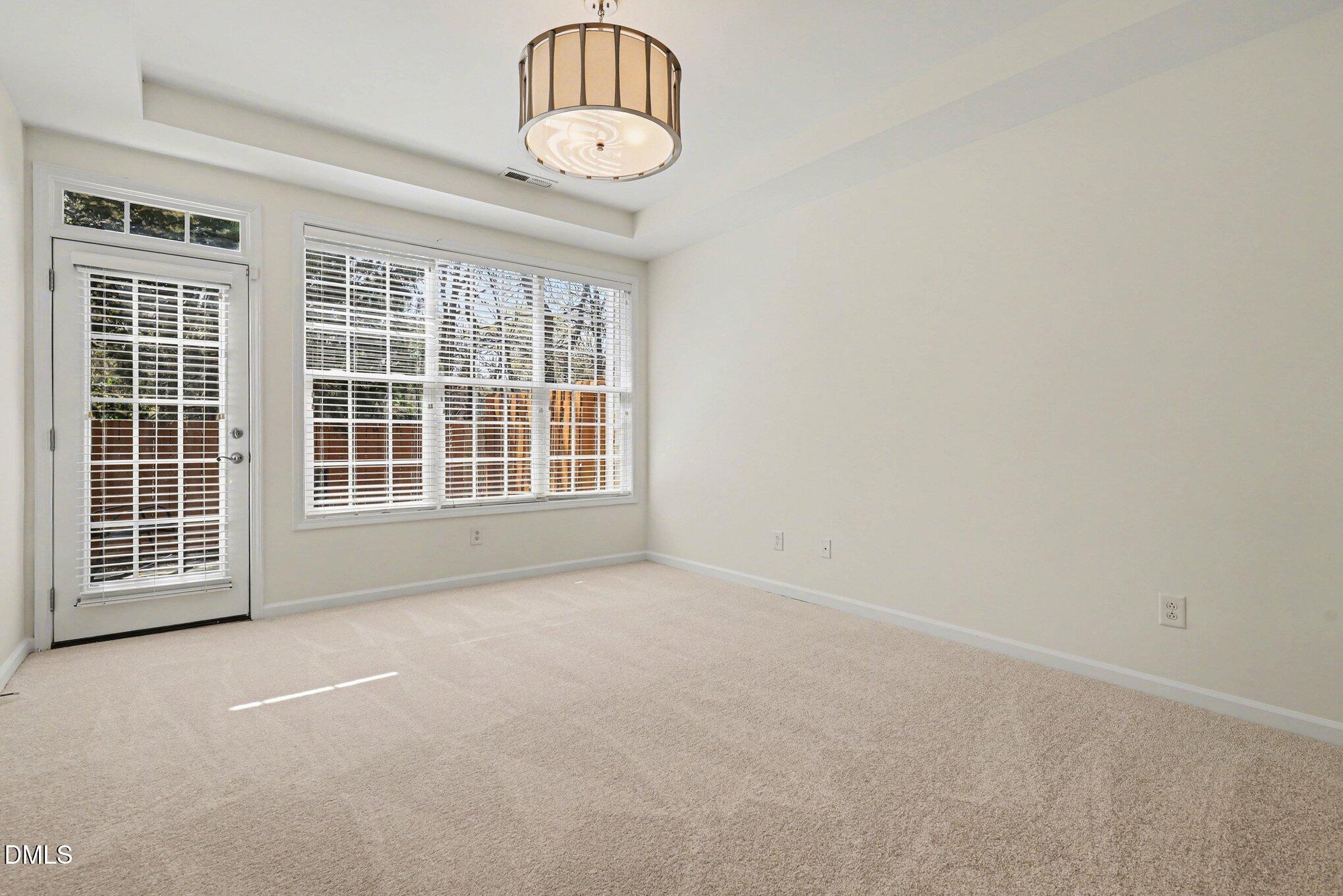 723 Swan Neck Lane Raleigh, NC 27615 - Photo 20 of 52 a view of an empty room with a kitchen