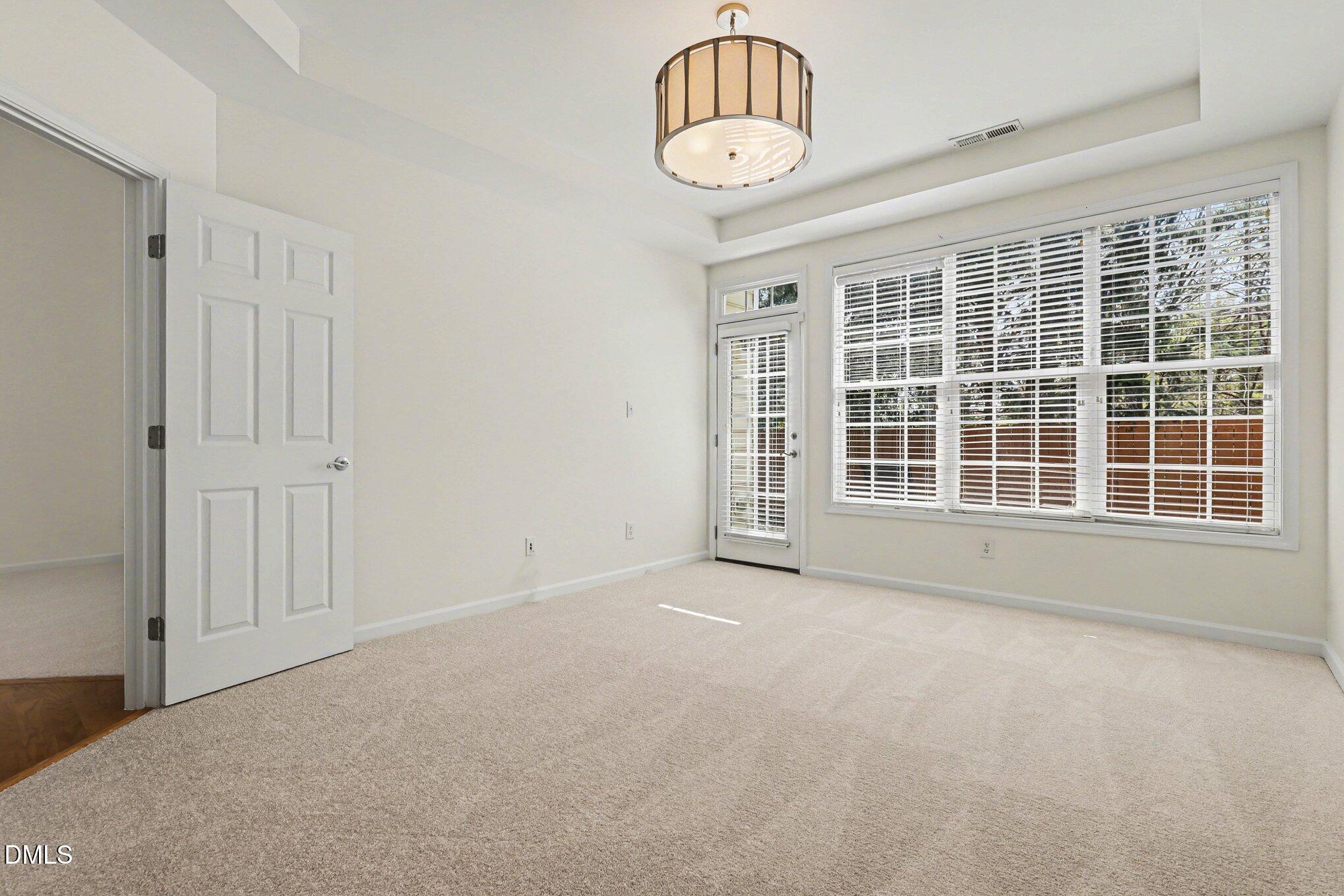 723 Swan Neck Lane Raleigh, NC 27615 - Photo 22 of 52 a view of an empty room with a window