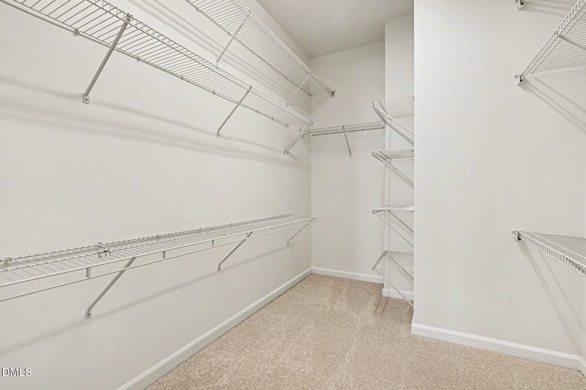 723 Swan Neck Lane Raleigh, NC 27615 - Photo 24 of 52 a view of a room with racks on the wall