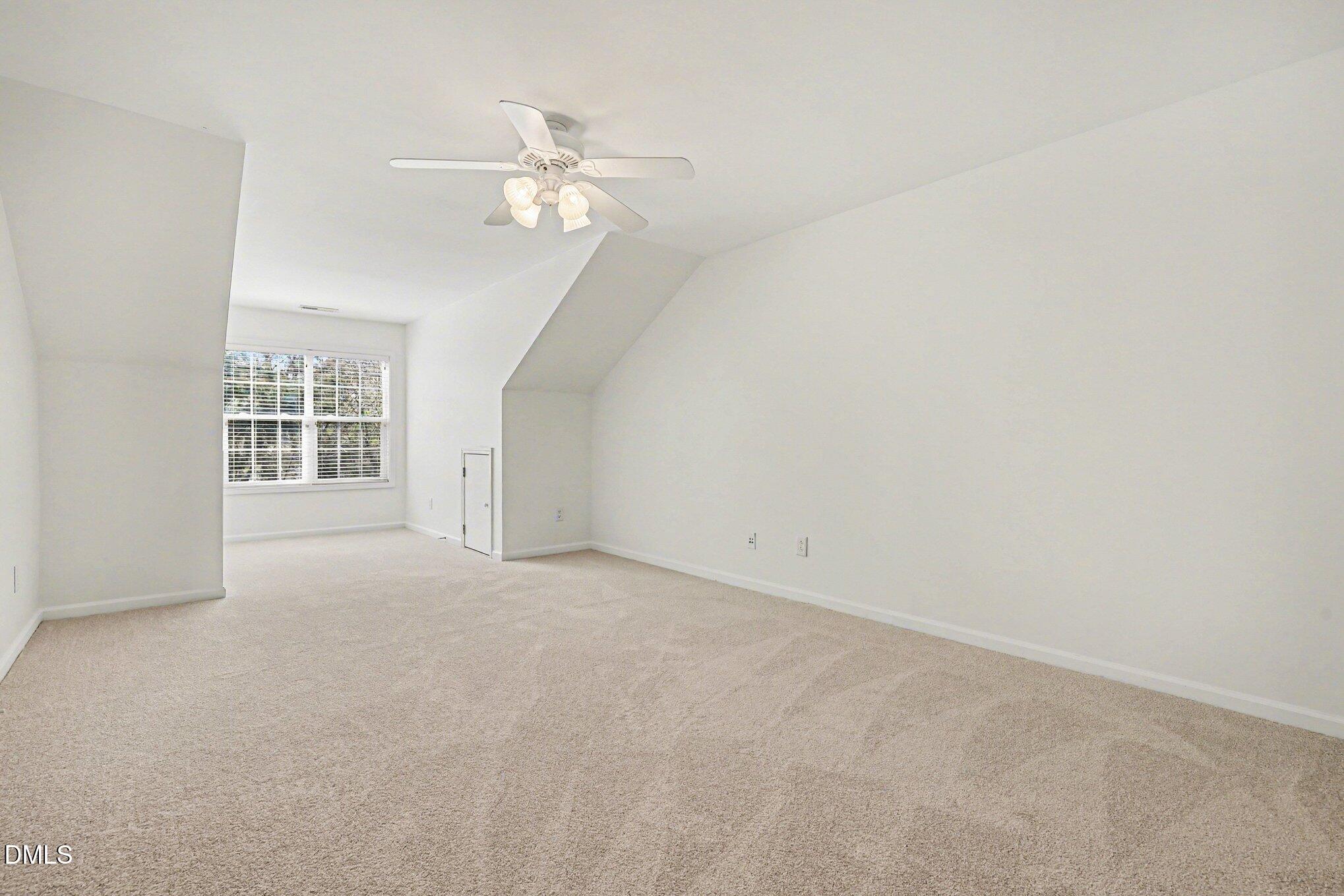 723 Swan Neck Lane Raleigh, NC 27615 - Photo 28 of 52 a view of an empty room with a chandelier fan