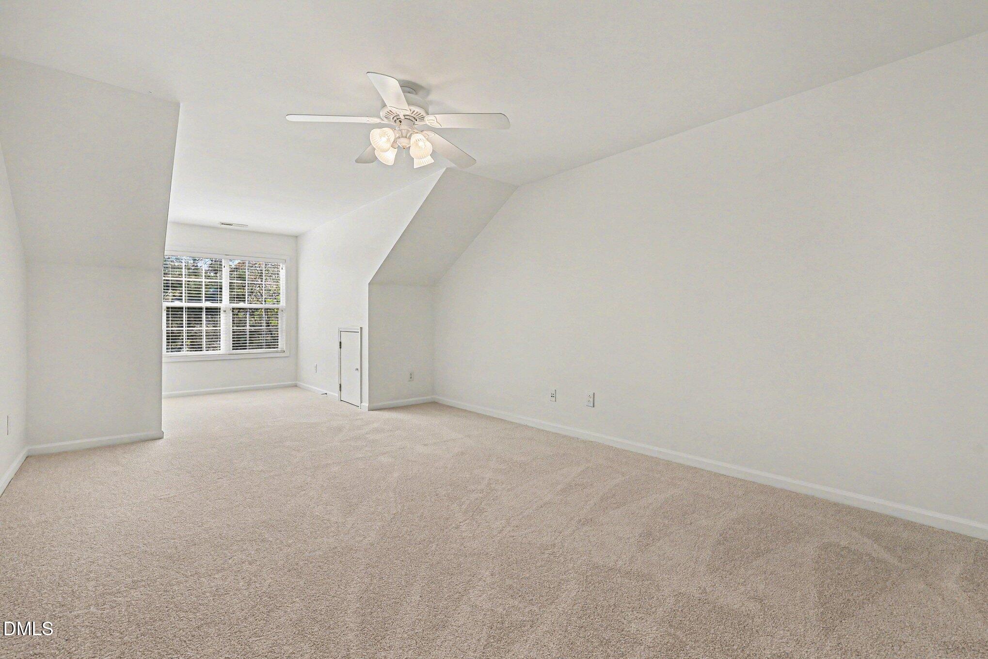 723 Swan Neck Lane Raleigh, NC 27615 - Photo 29 of 52 a view of an empty room with a chandelier fan