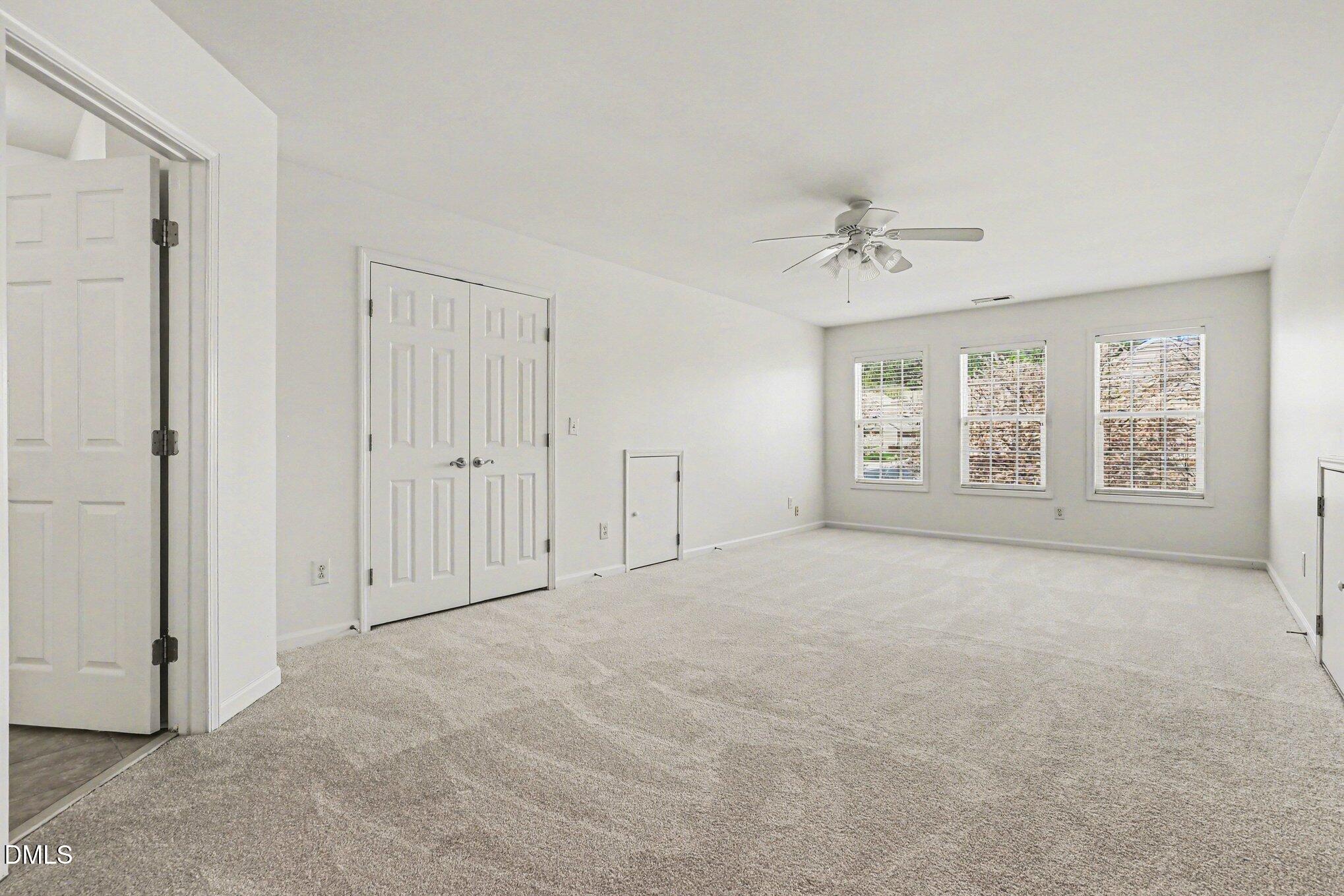 723 Swan Neck Lane Raleigh, NC 27615 - Photo 31 of 52 an empty room with windows and closet