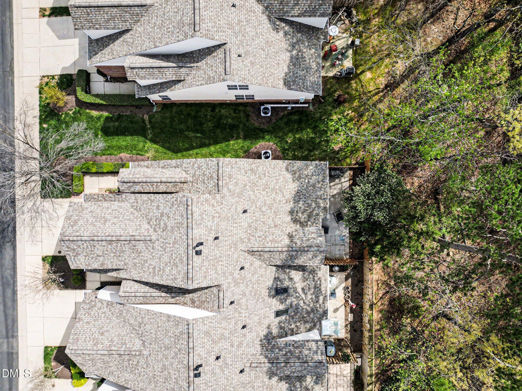 723 Swan Neck Lane Raleigh, NC 27615 - Photo 35 of 52 an aerial view of a house with a yard and large trees