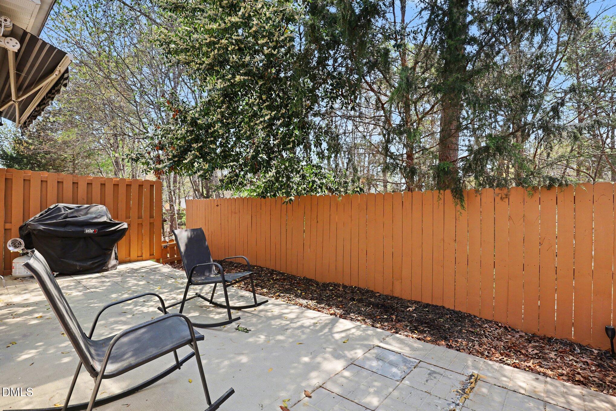 723 Swan Neck Lane Raleigh, NC 27615 - Photo 37 of 52 a view of a backyard and table and chairs
