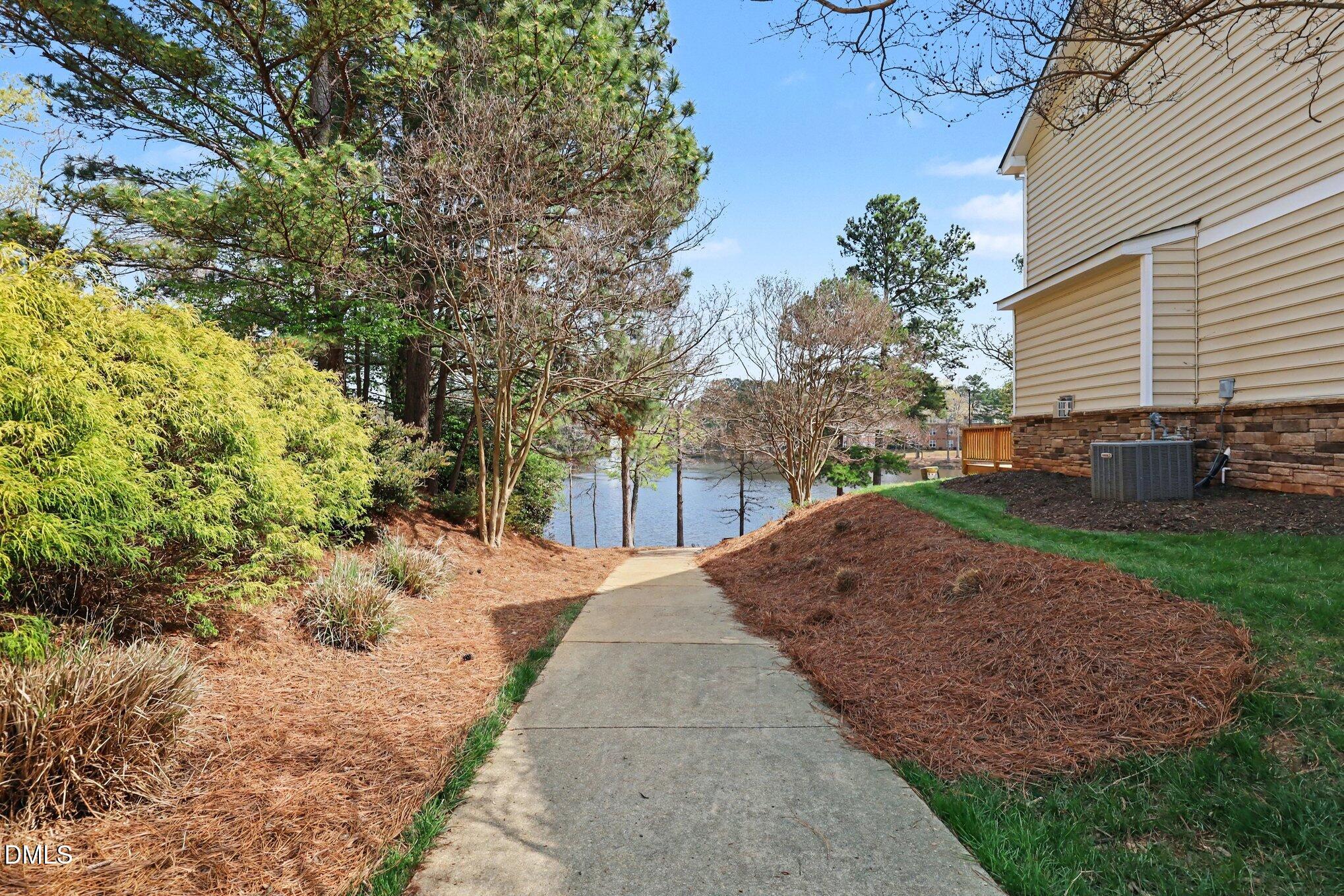 723 Swan Neck Lane Raleigh, NC 27615 - Photo 42 of 52 a view of a backyard with sitting area
