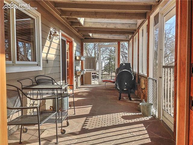 10380 Link Road Fountain, CO 80817 - Photo 24 of 35 Screened in porch with access from great room or master bath.