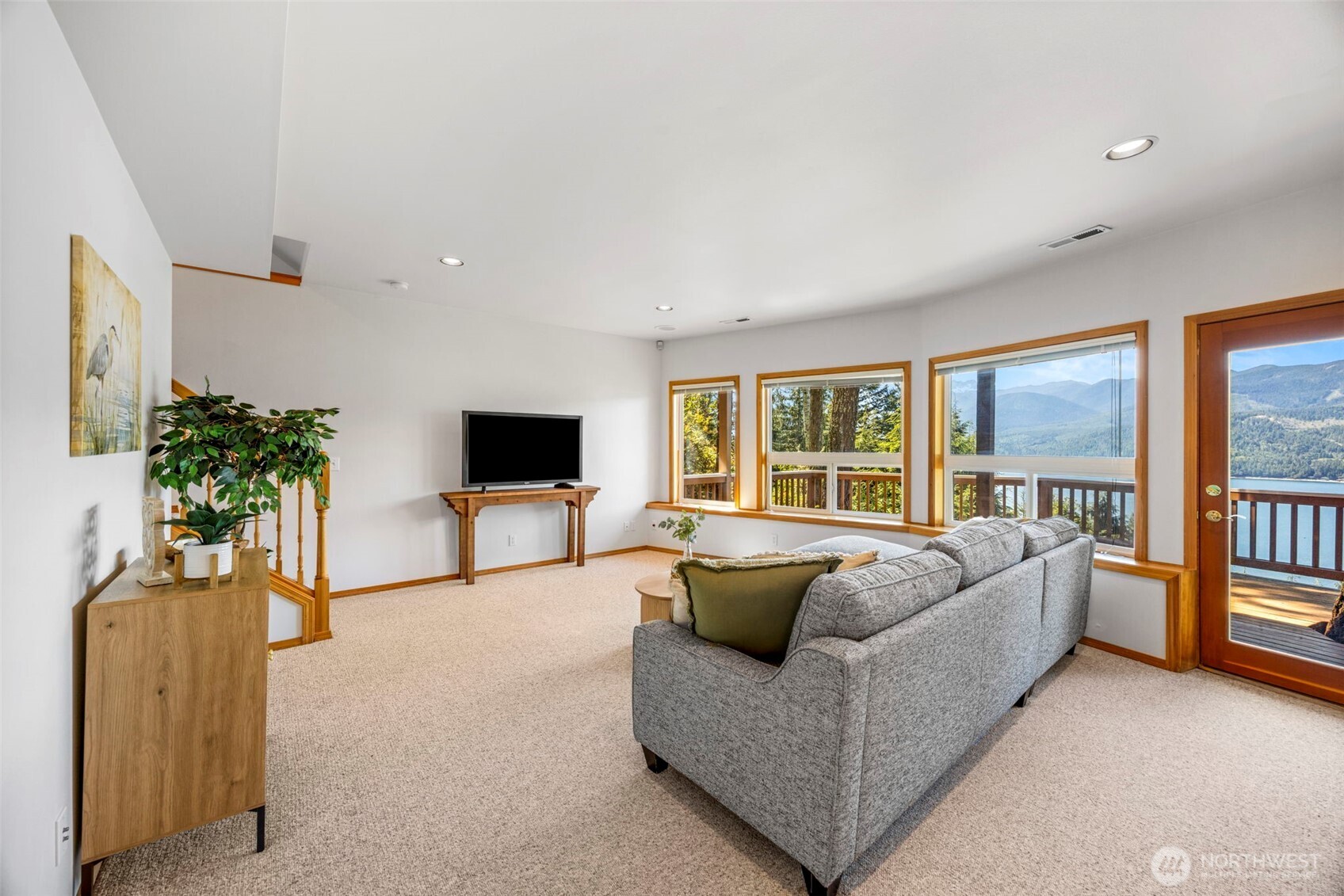 19736 Northwest Stavis Bay Road Seabeck, WA 98380 - Photo 28 of 39 a living room with furniture and a flat screen tv