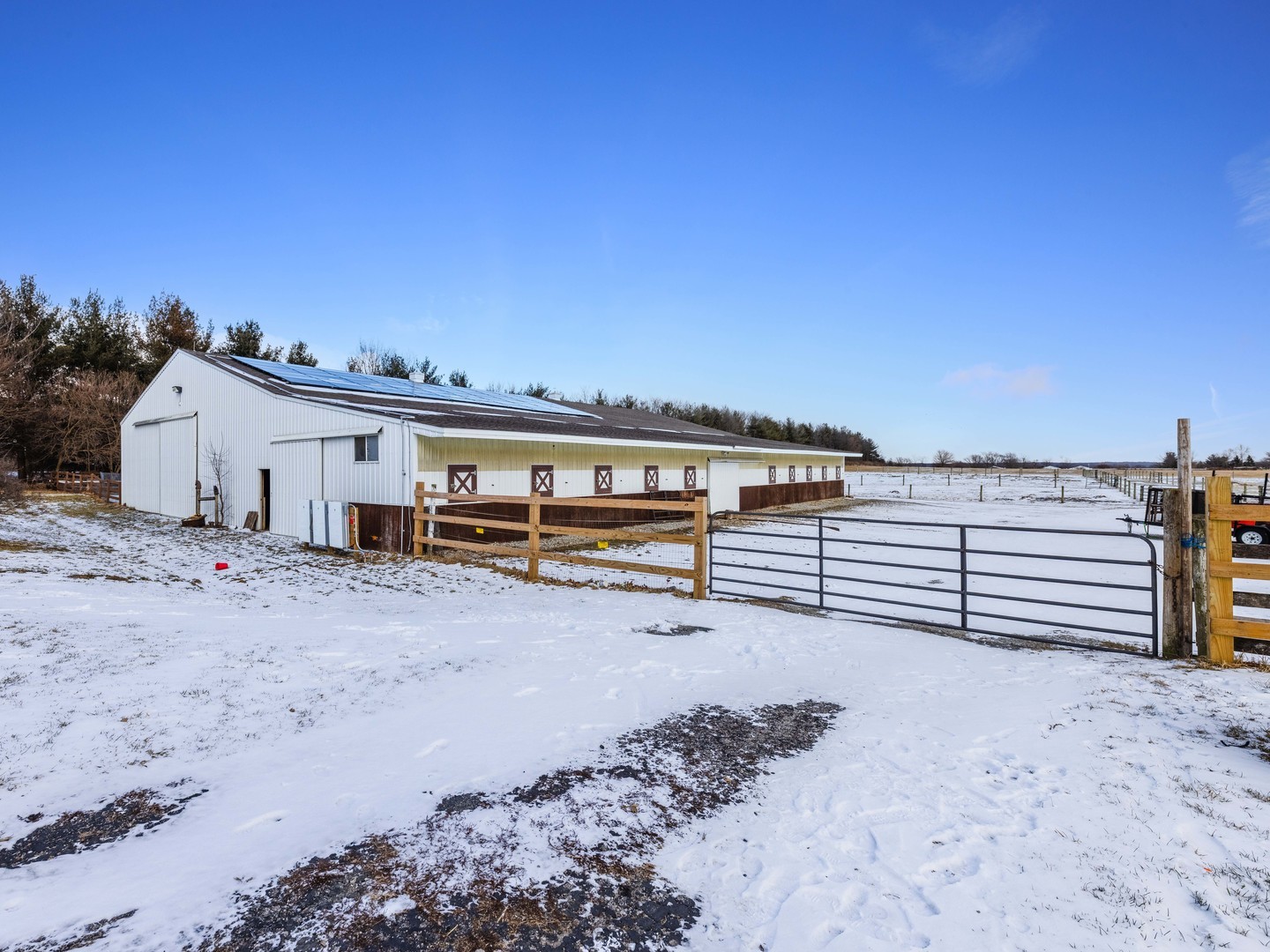 29153 South Klemme Road Beecher, IL 60401 - Photo 20 of 54 a view of a large building with wooden fence