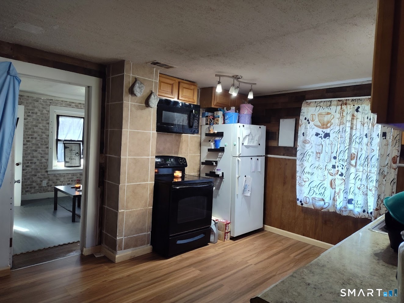 13 Rose Street Norwich, CT 06360 - Photo 8 of 21 a kitchen view with refrigerator and stove