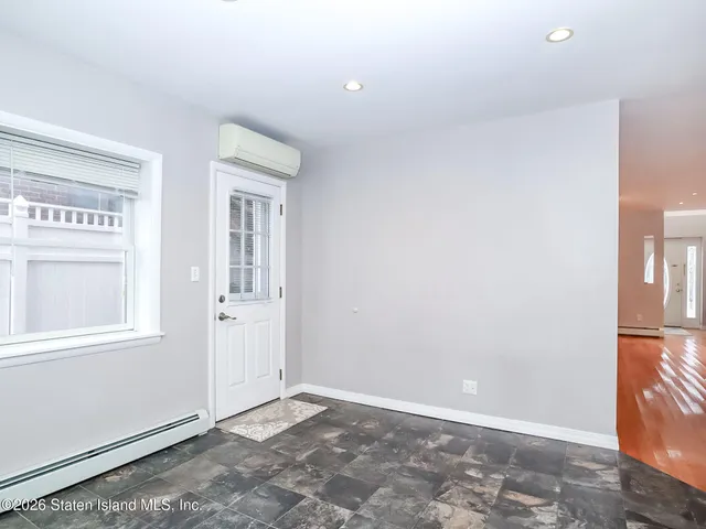 an empty room with windows