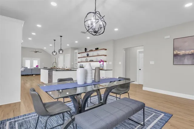 a dining room with furniture and window