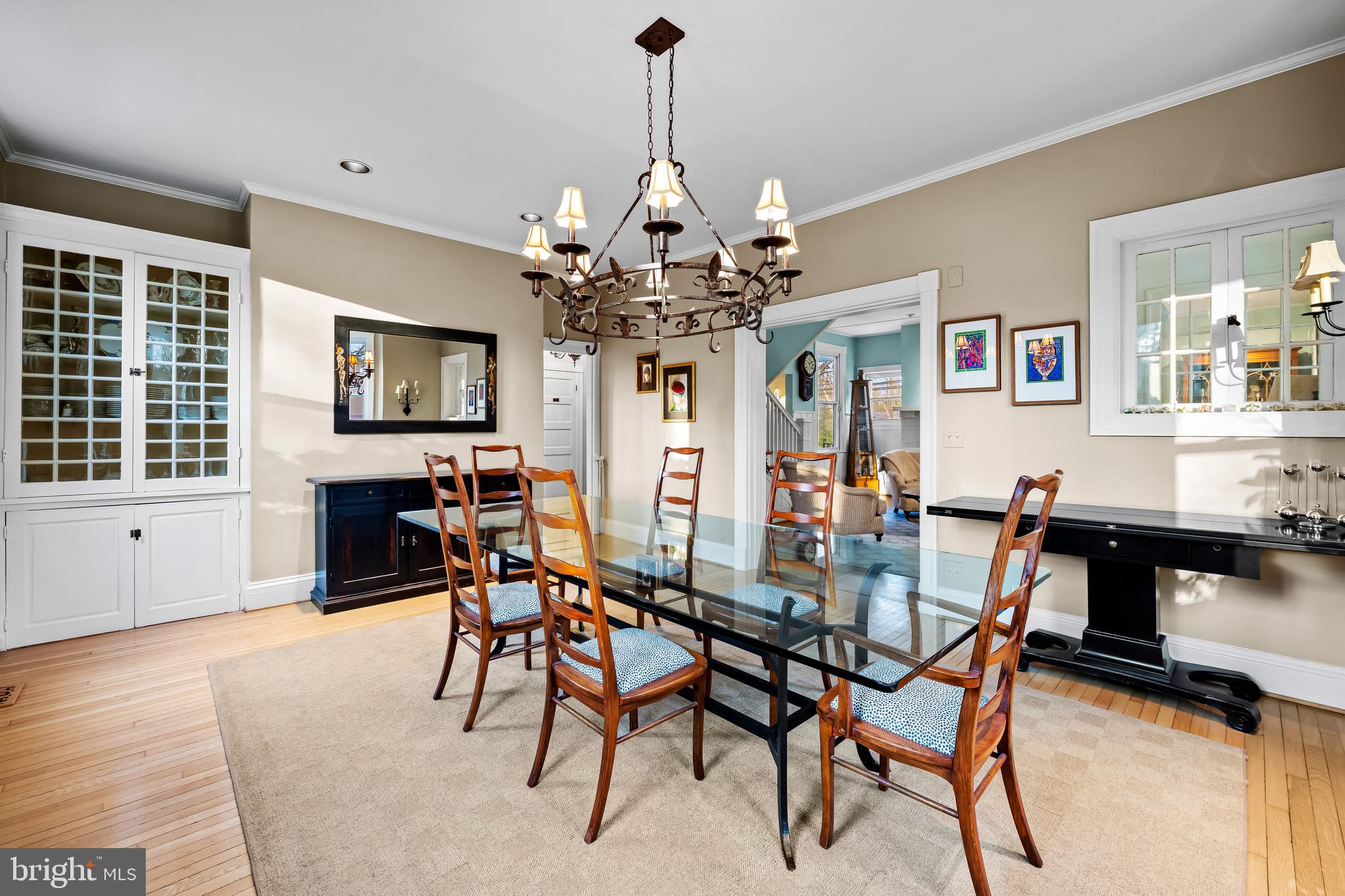 8412 Stevenson Road Baltimore, MD 21208 - Photo 25 of 77 a view of a dining room with furniture a chandelier and wooden floor