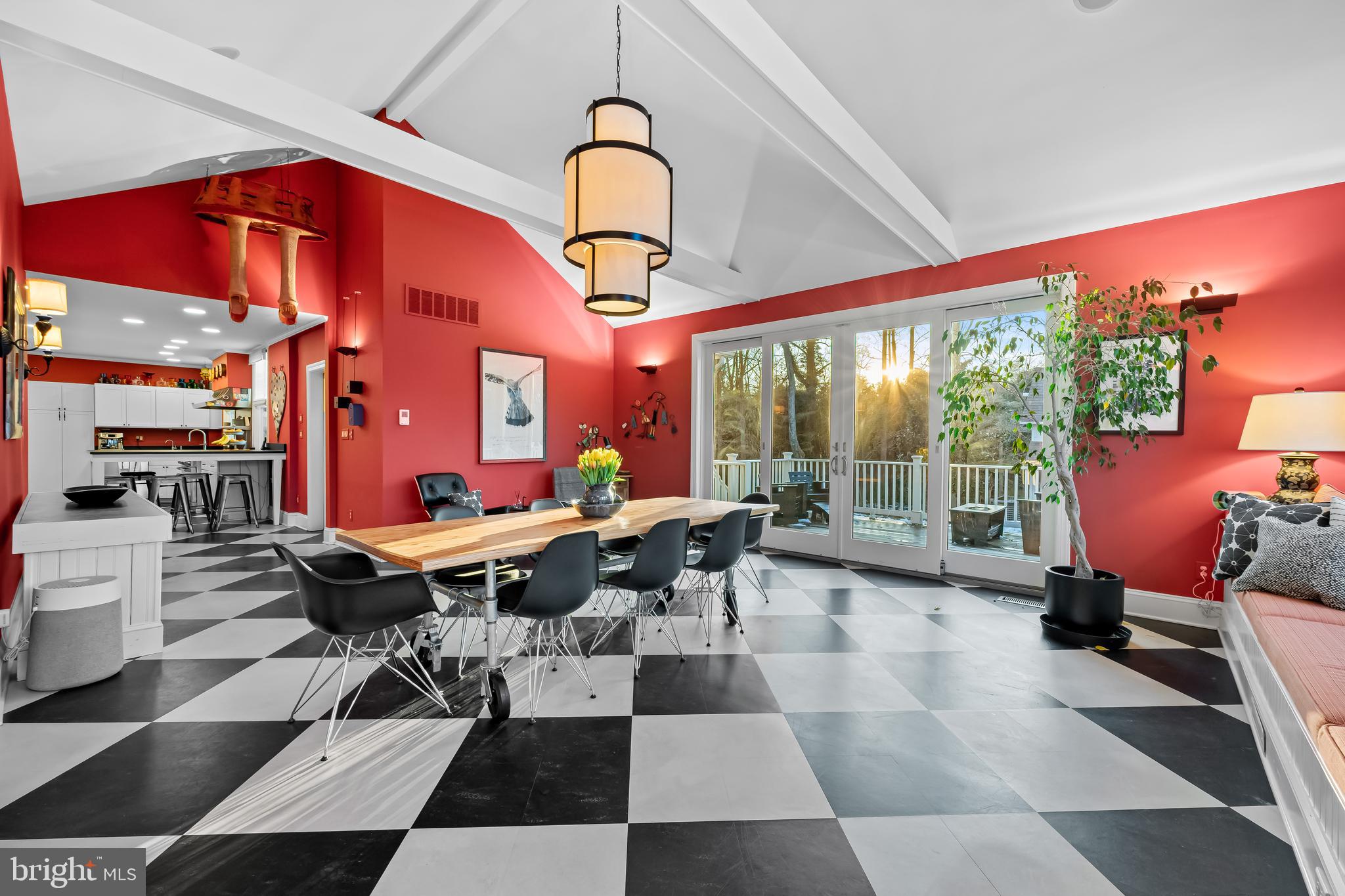 8412 Stevenson Road Baltimore, MD 21208 - Photo 34 of 77 a living room with furniture a rug and a floor to ceiling window