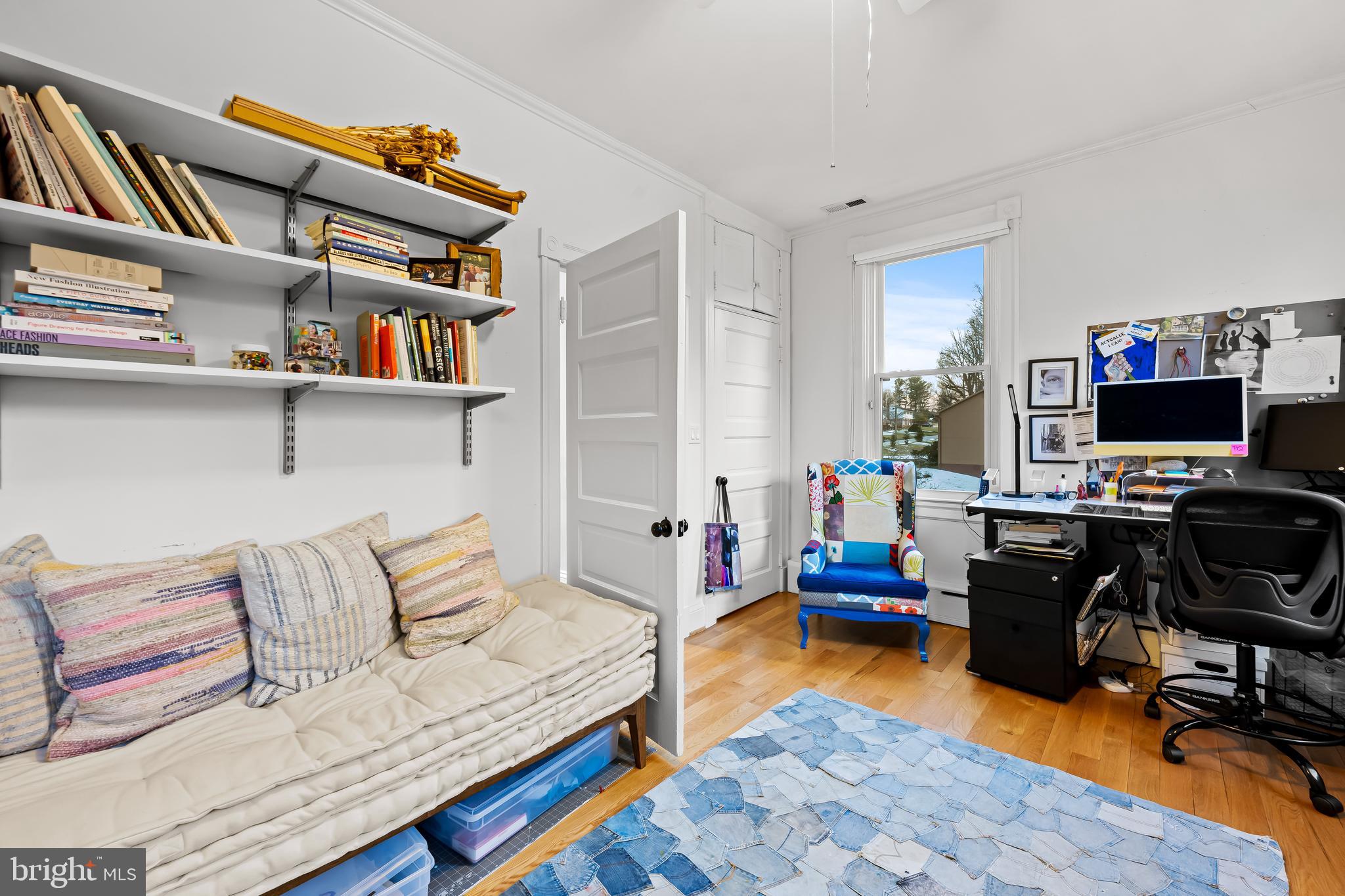 8412 Stevenson Road Baltimore, MD 21208 - Photo 55 of 77 a bedroom with furniture and a book shelf