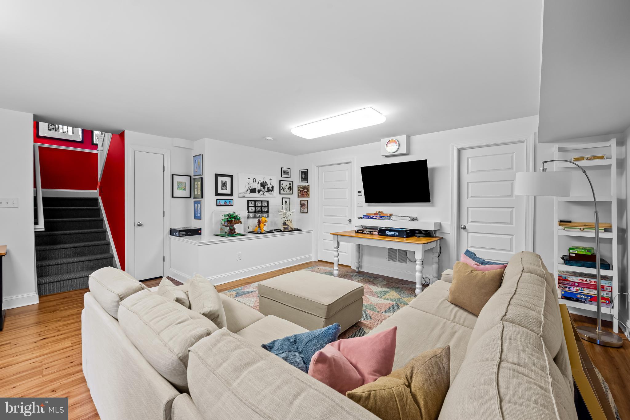 8412 Stevenson Road Baltimore, MD 21208 - Photo 66 of 77 a living room with furniture and a flat screen tv