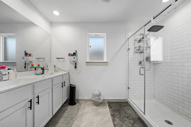 a bathroom with a sink and mirror