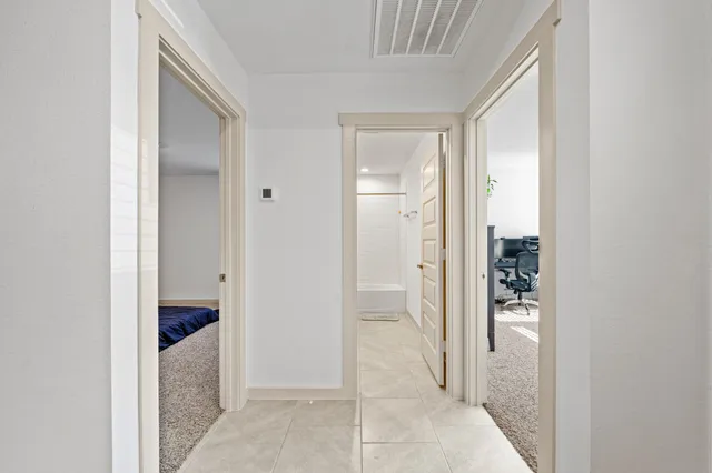 a view of a bathroom from a hallway