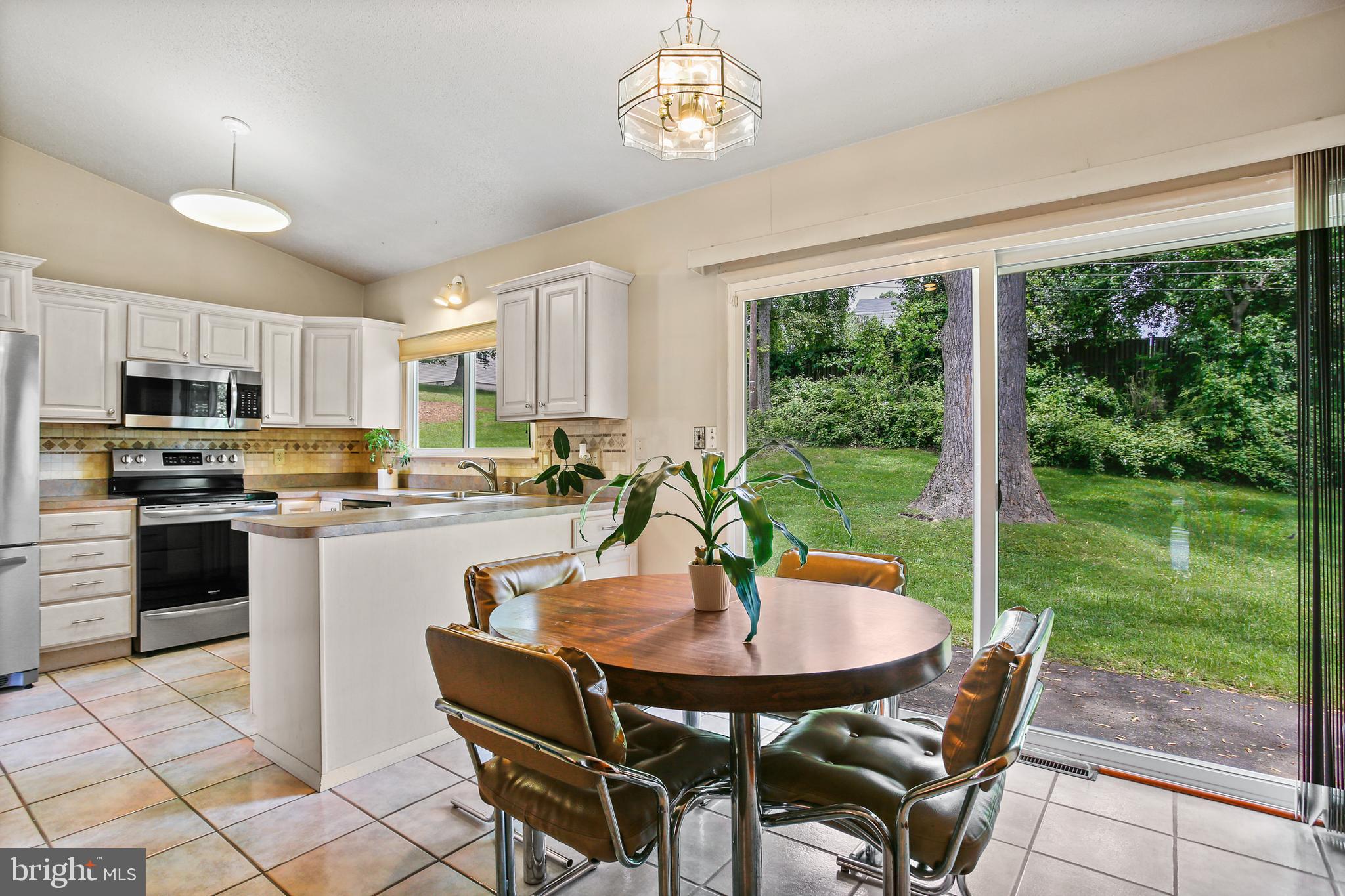 8216 Scotts Level Road Pikesville, MD 21208 - Photo 11 of 42 Eat-in Kitchen w/ Sliders to Rear Patio & Yard