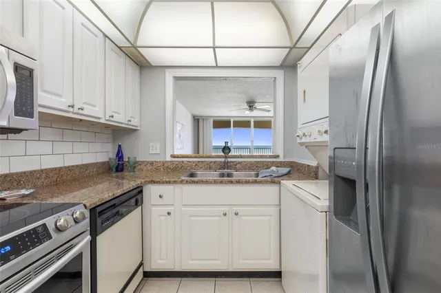 a bathroom with a bath tub with a shower