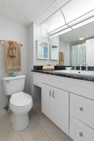 a view of roof with city view