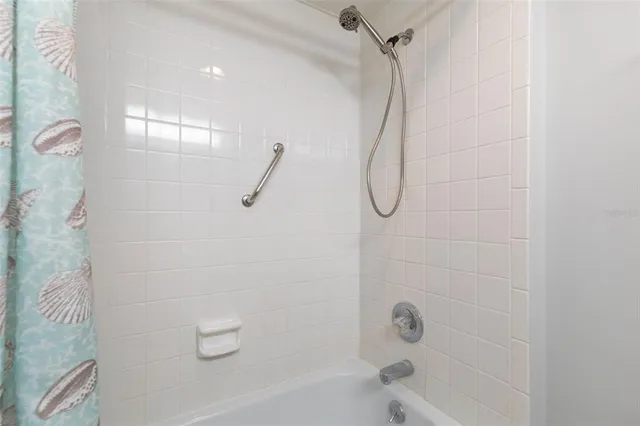 a view of swimming pool with outdoor seating and city view