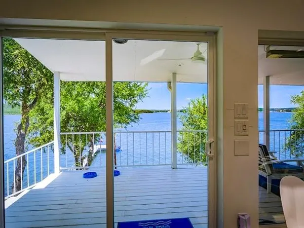 a view of a balcony with wooden floor