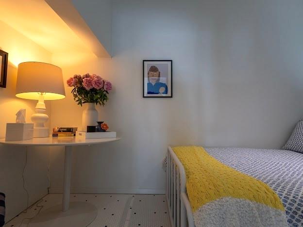 2459 Upper Burma Road Graford, TX 76449 - Photo 27 of 40 a bedroom with a bed and a lamp on table