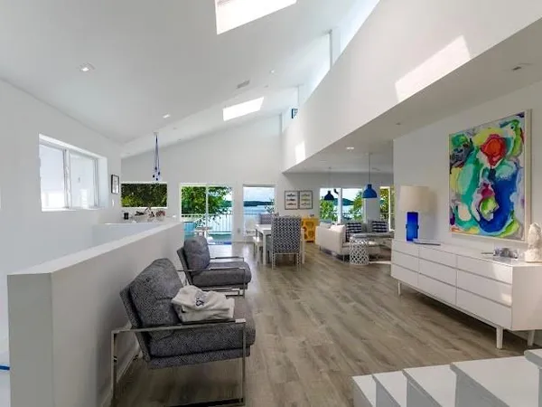 a living room with furniture fireplace and a window