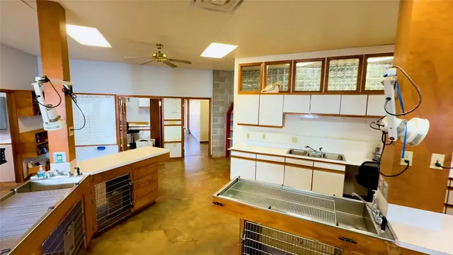 a kitchen with sink refrigerator and stove