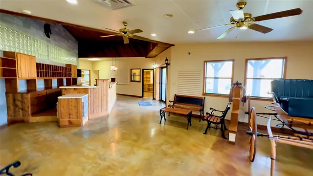 a view of a house with yard and sitting area