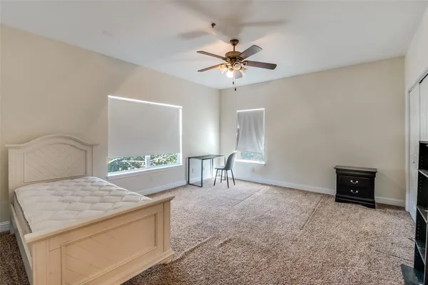 a living room with a bed and a table