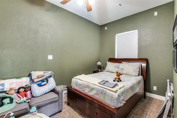 a bed room with a bed and with chair
