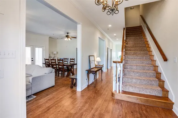a view of a living room and entryway with wooden floor