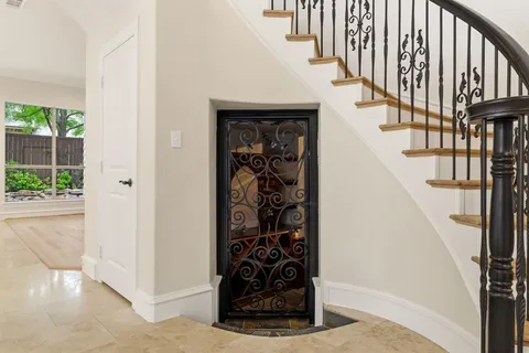 a view of entryway with wooden floor and stairs
