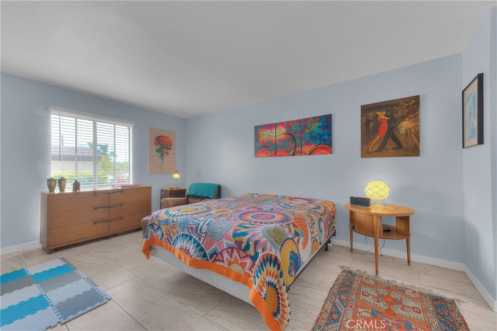 6351 Riverside Drive, Unit 69 Chino, CA 91710 - Photo 10 of 21 a bedroom with a bed and a window