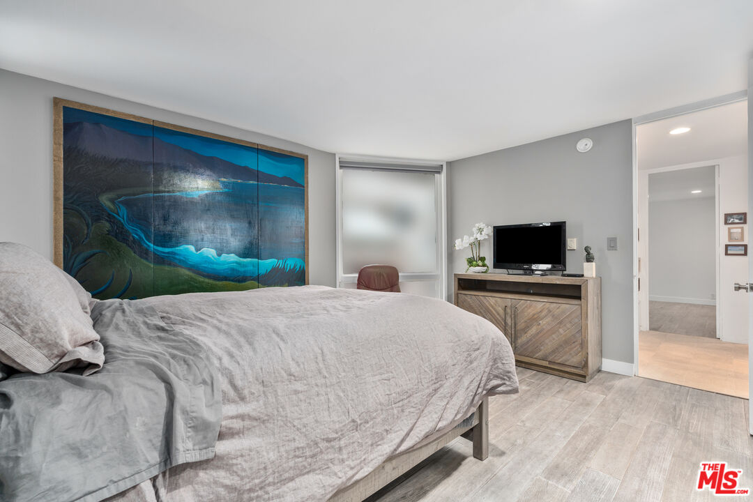 6 Fleet Street, Unit 203 Marina del Rey, CA 90292 - Photo 15 of 25 a bedroom with a bed and a television