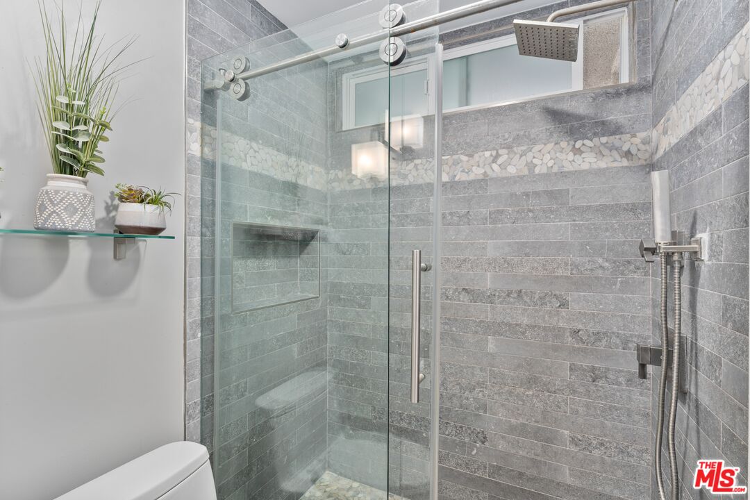 6 Fleet Street, Unit 203 Marina del Rey, CA 90292 - Photo 17 of 25 a bathroom with a shower and toilet