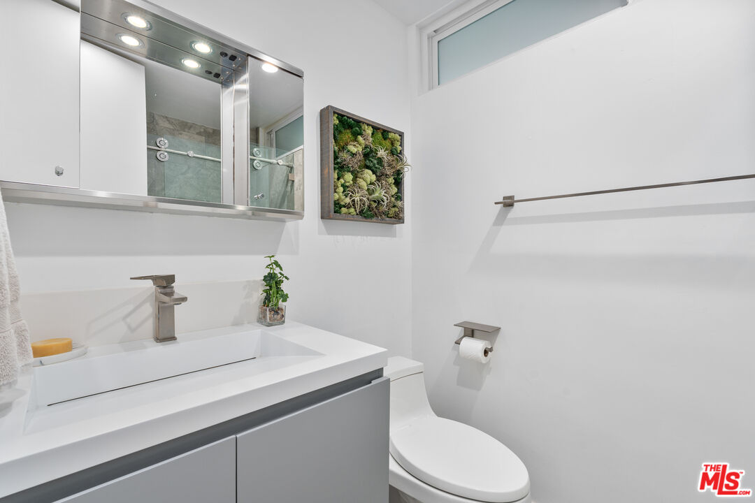 6 Fleet Street, Unit 203 Marina del Rey, CA 90292 - Photo 20 of 25 a bathroom with a sink a toilet and shower