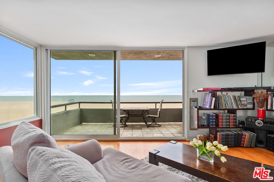 6 Fleet Street, Unit 203 Marina del Rey, CA 90292 - Photo 2 of 25 a living room with fireplace furniture and a flat screen tv