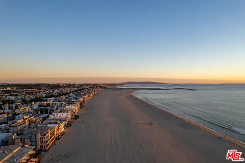 an aerial view of beach and ocean