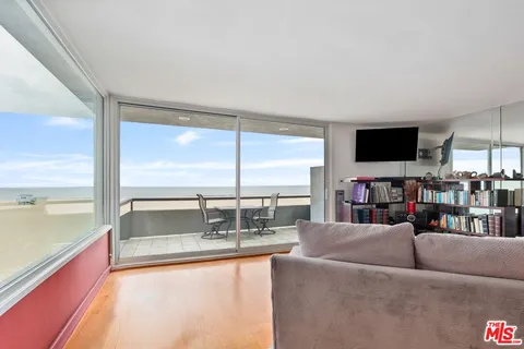 a living room with couch and a flat screen tv
