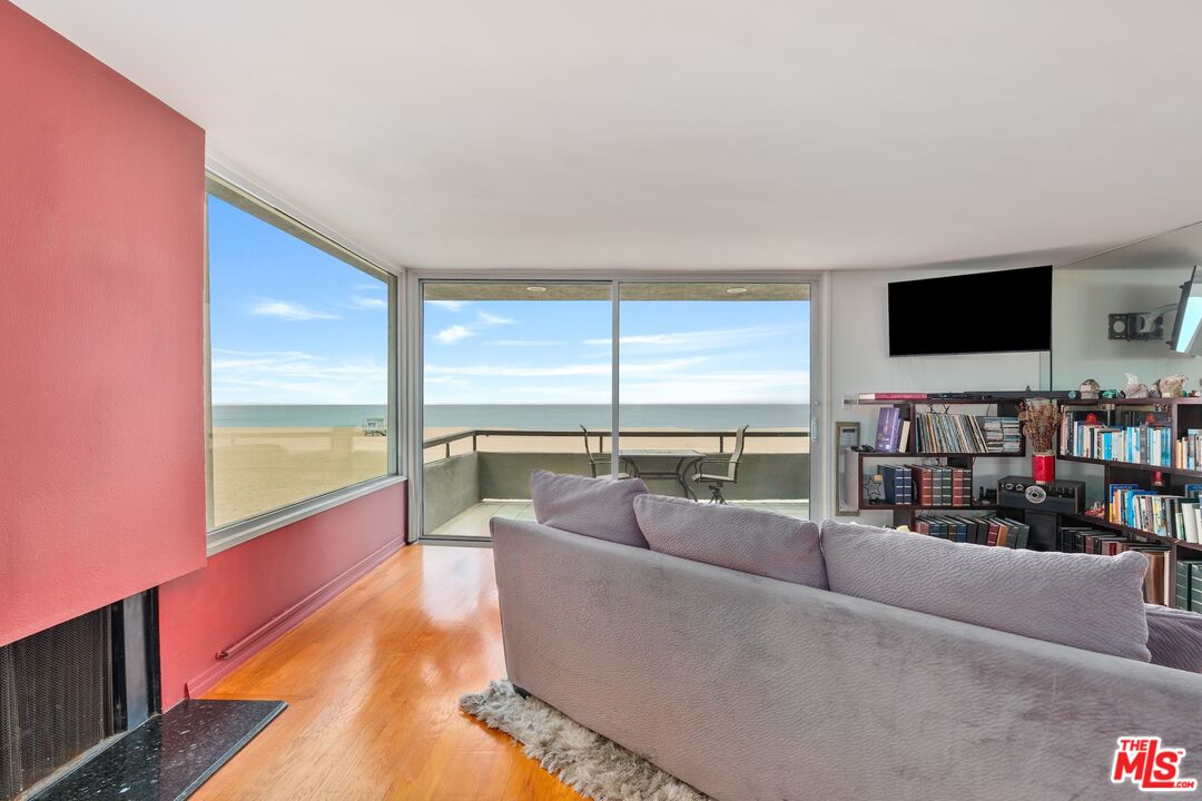 6 Fleet Street, Unit 203 Marina del Rey, CA 90292 - Photo 5 of 25 a living room with furniture and a flat screen tv