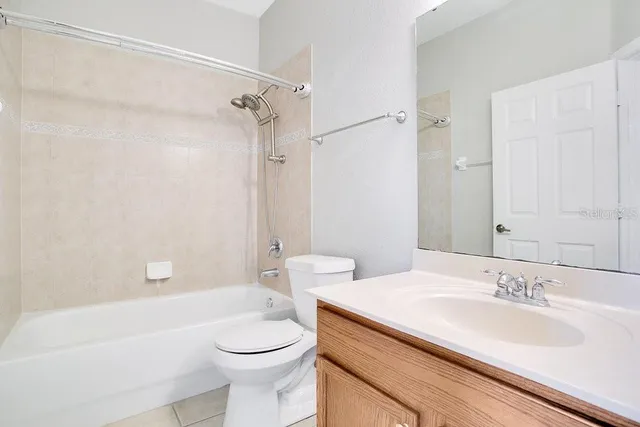 a bathroom with a sink a toilet and a bathtub